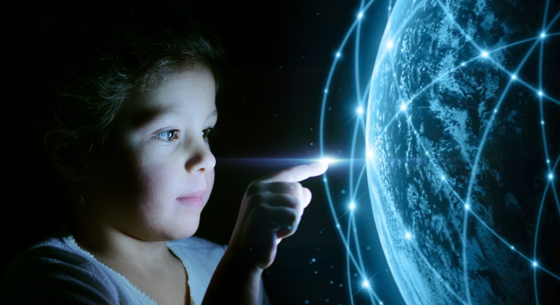 Photo of a oyung boy looking at a futuristic world